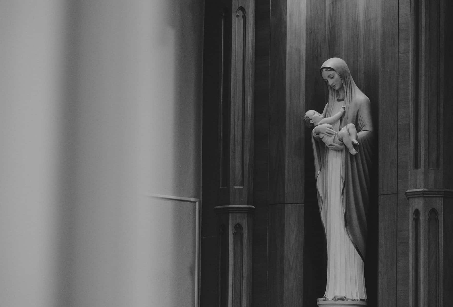 Black and white photo of statue of Mary holding baby Jesus.