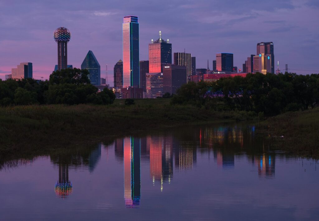 Late evening sunset view of Downtown Dallas from across the Trinity River.