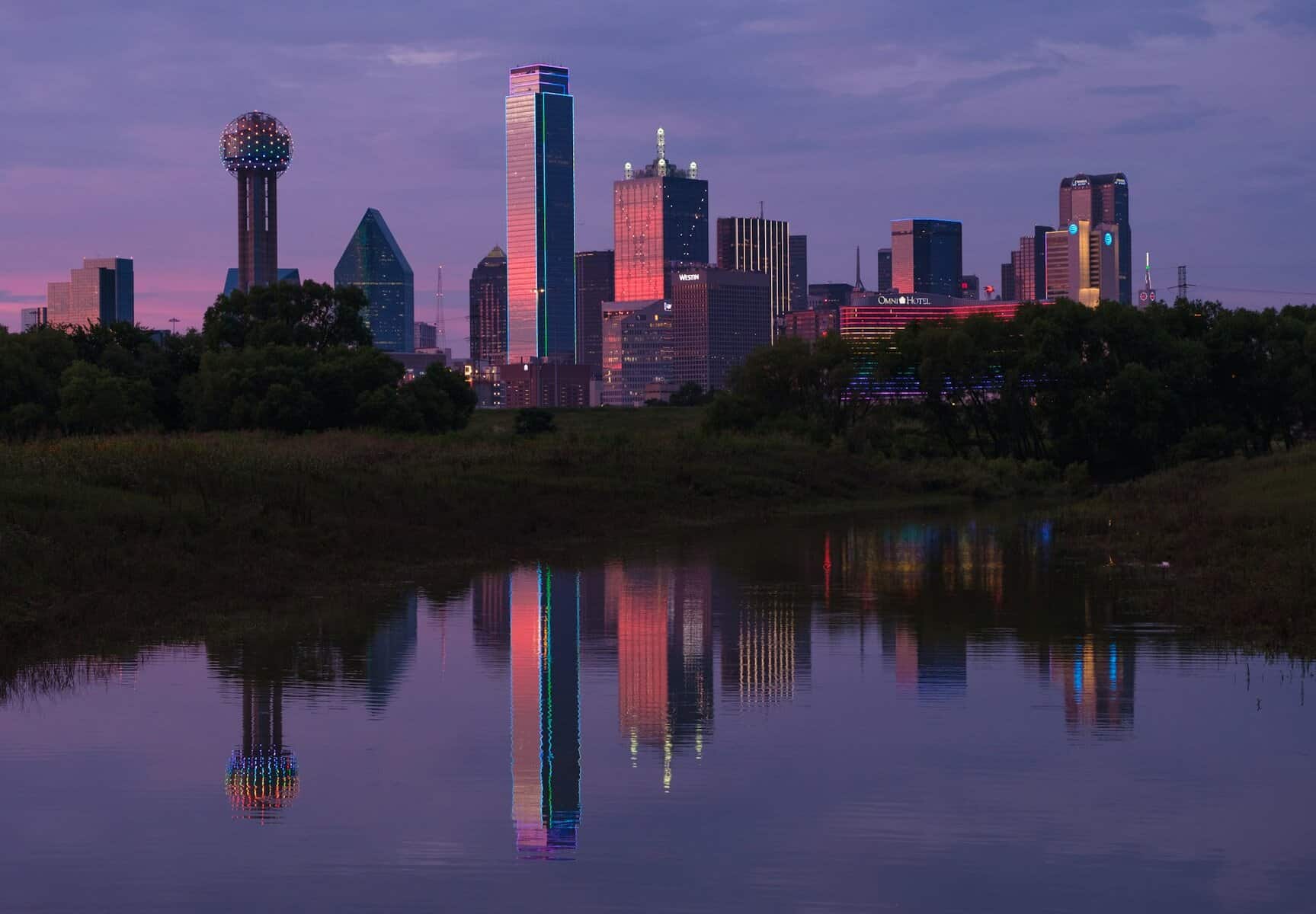 Late evening sunset view of Downtown Dallas from across the Trinity River.