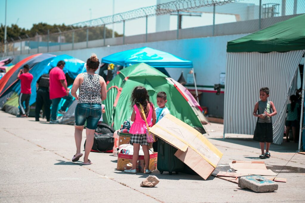 Peril at the Border: Catholic Charities of the Rio Grande Valley in DHS crosshairs Migrants at a border camp in Mexico.