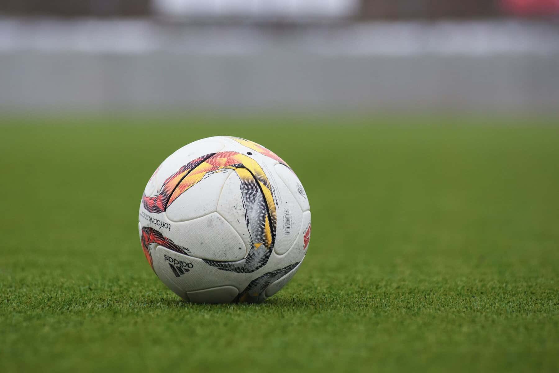 A soccer ball sitting on a field.