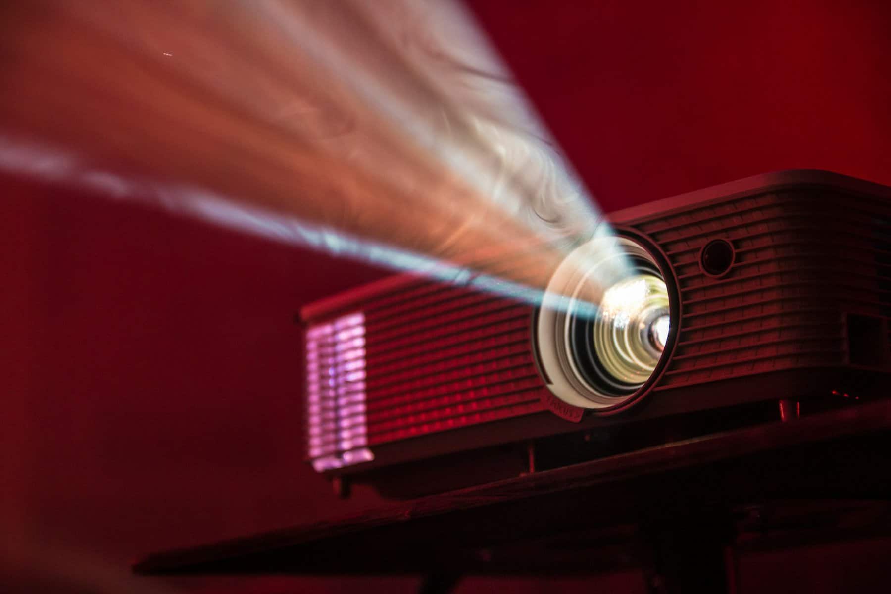 A projector with it's beam of light.