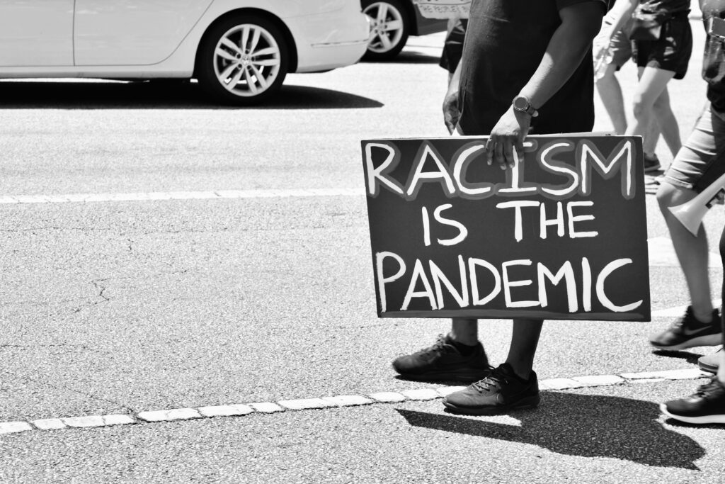 Church vs. Kinism: Why a Presbyterian pastor was cast out A protest sign say Racism is the pandemic.
