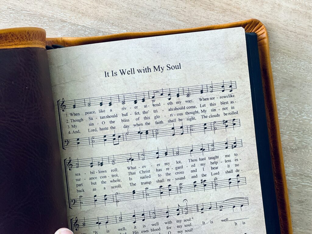 A hymn book is open to It is well with my soul.