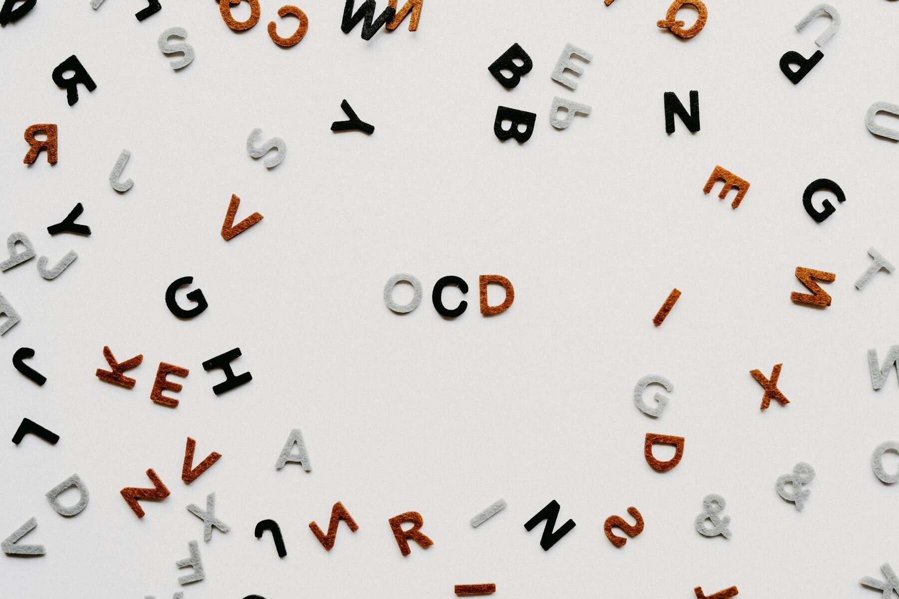 Random multicolored letters with OCD in the middle.