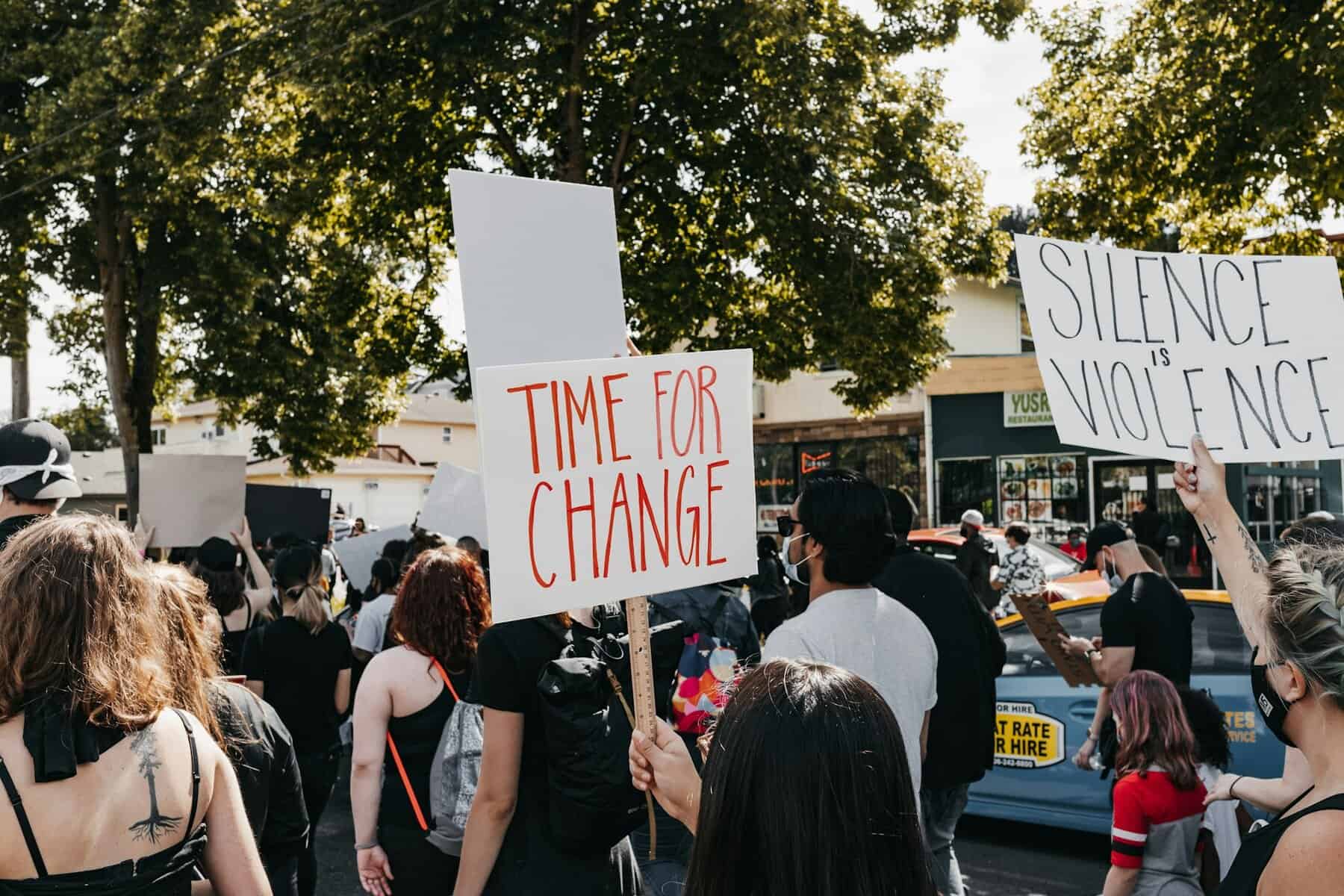 Protestors carrying signs.
