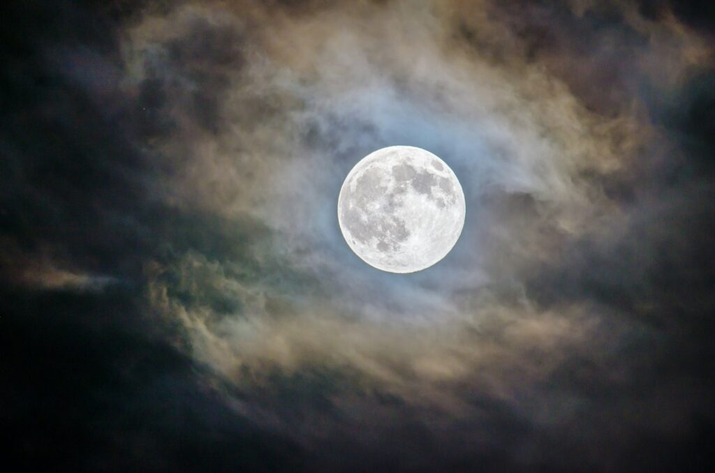 Powerful Verdict: Court orders Unification Church dissolution and damages The moon is shown between clouds.
