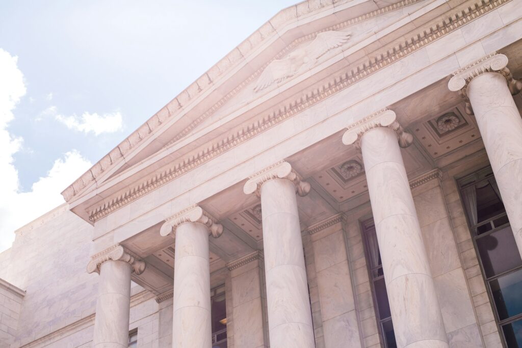 Supreme Court Asylum Fight: Faith leaders deliver powerful warning Closeup of a federal building and it's columns in Washington D.C.